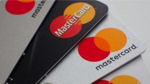 Close-up of a stack of debit bank cards loaded with Mastercard credit.