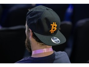 An attendee wears a hat with the Bitcoin logo during the Dubai Crypto Expo at the Festival Arena in Dubai, United Arab Emirates, Wednesday, March 8, 2023. Photographer: Christopher Pike/Bloomberg